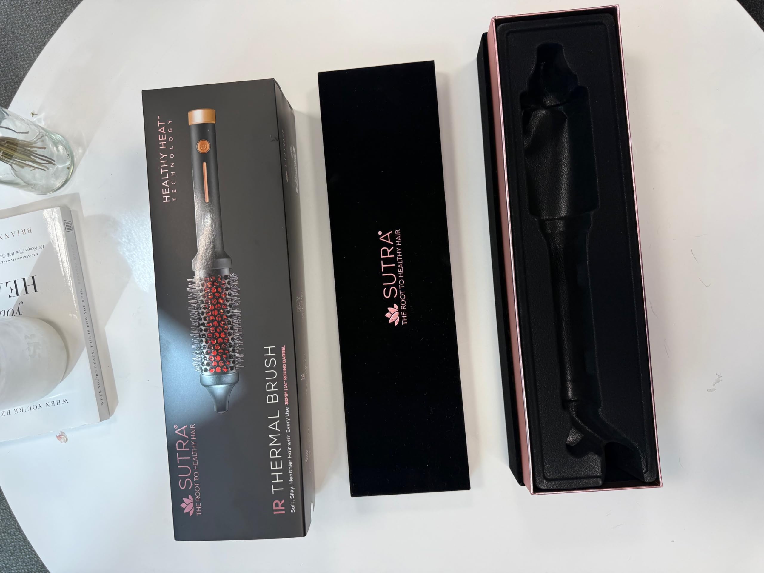 SUTRA Thermal Brush tourmaline-infused bristles deliver glossy, frizz-free shine.