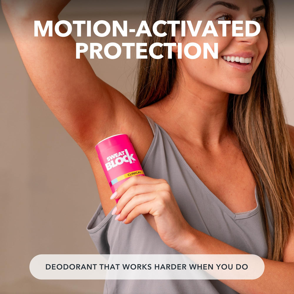 SweatBlock Women using deodorant during outdoor activity for freshness.