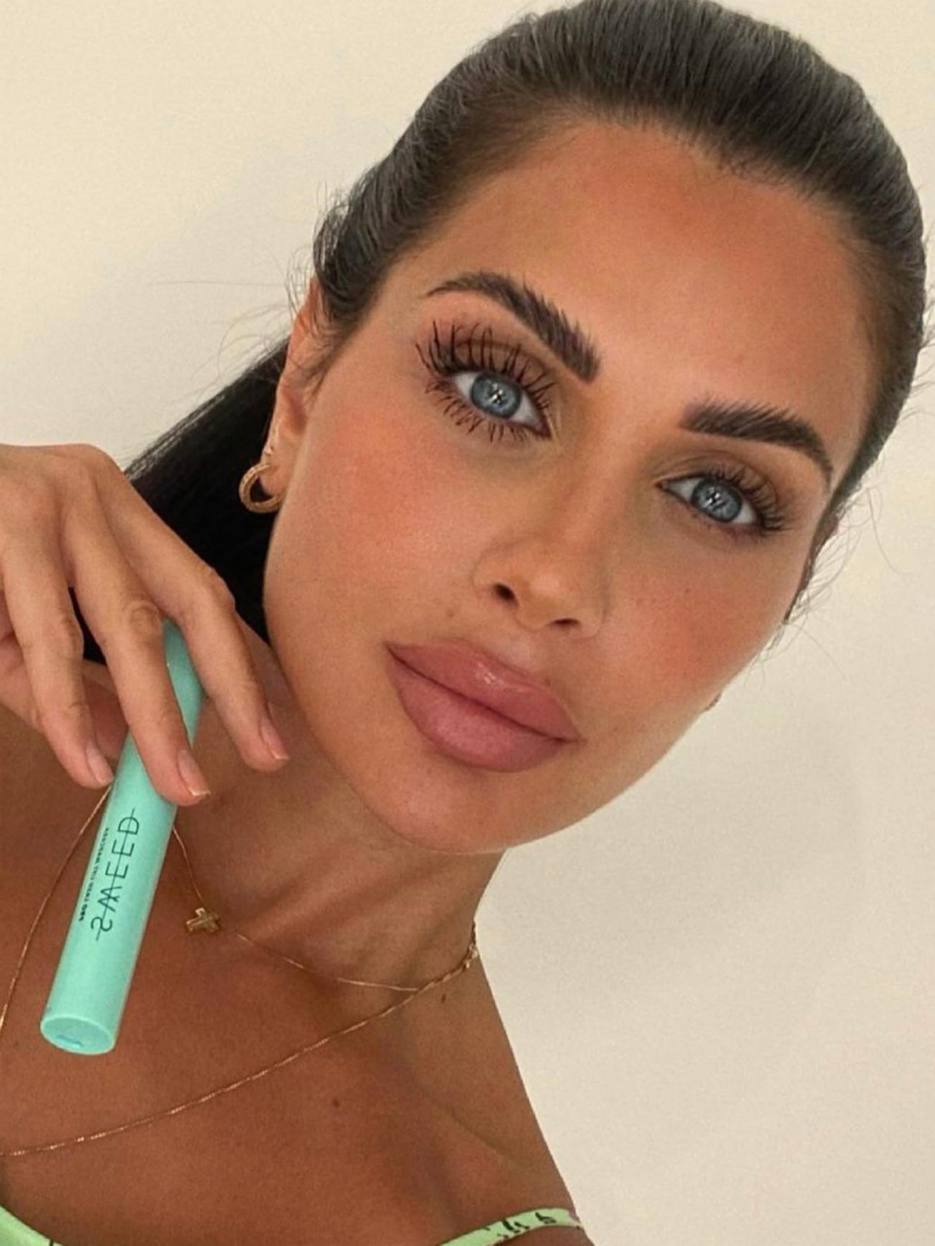 Sweed Lash Lift Mascara wand closeup showing skinny wand for precise root-to-tip lift.