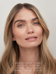 Sweed Le Lipstick application on lips demonstrates plump, moisturized finish