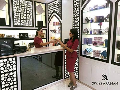 Swiss Arabian Rasheeqa traditional attar-style bottle evokes Middle Eastern perfumery heritage.