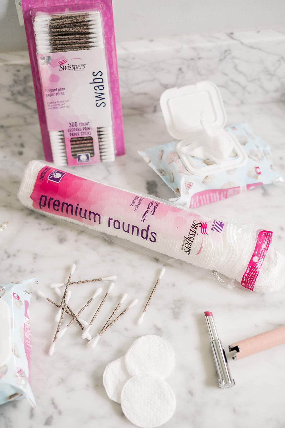Swisspers Premium Cotton Rounds smooth-side application closeup for toner use.
