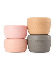 TakeToday apricot four-pack travel containers with secure lids for spill-free packing.