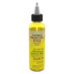 Taliah Waajid Hair Gro Bamboo Coconut Milk Oil application drop demonstrates easy scalp-friendly use