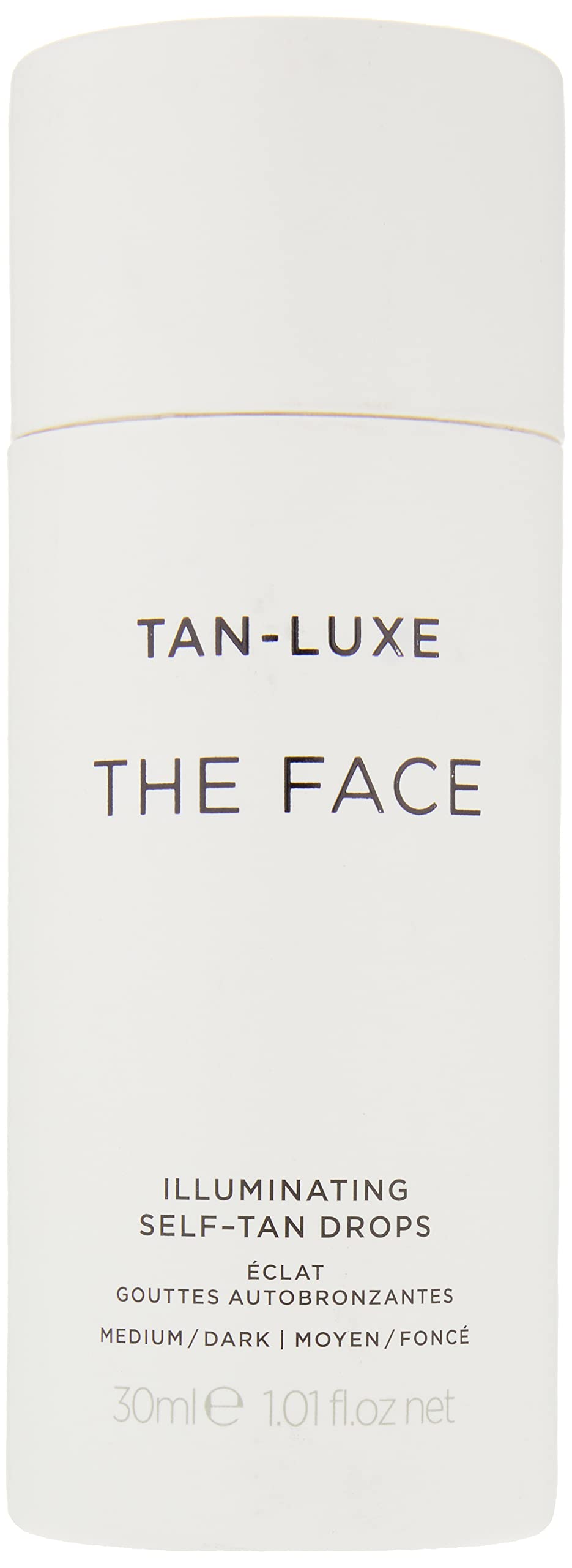 Tan-Luxe The Face Illuminating Drops dropper dispensing precise amount for gradual shade.