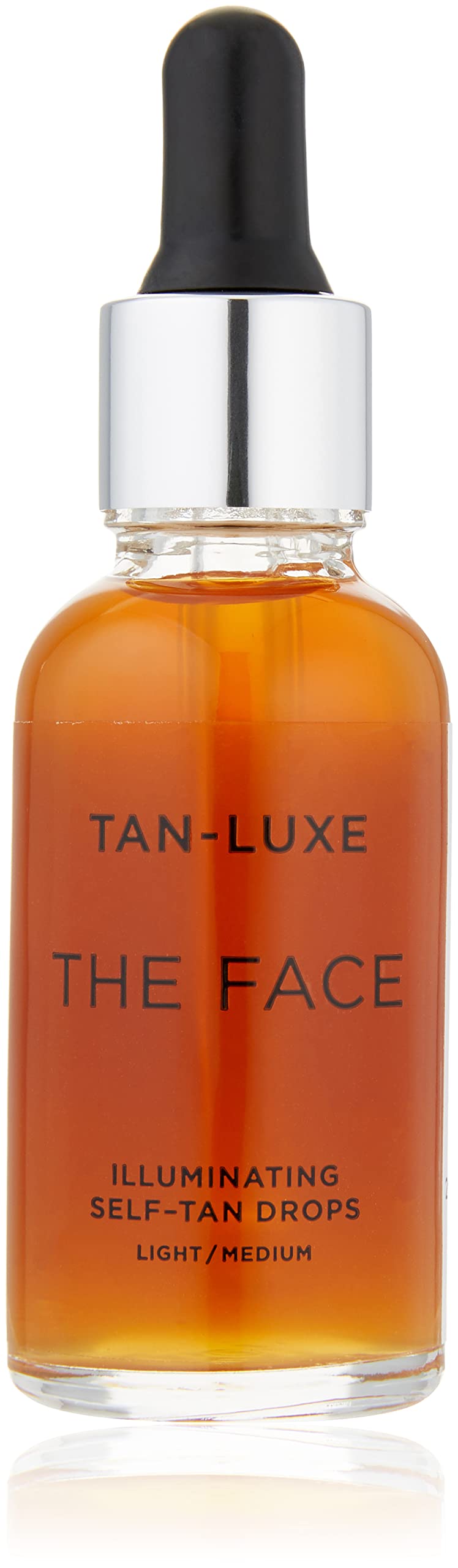 Tan-Luxe The Face bottle close-up highlights illuminating self-tan drops for a natural glow