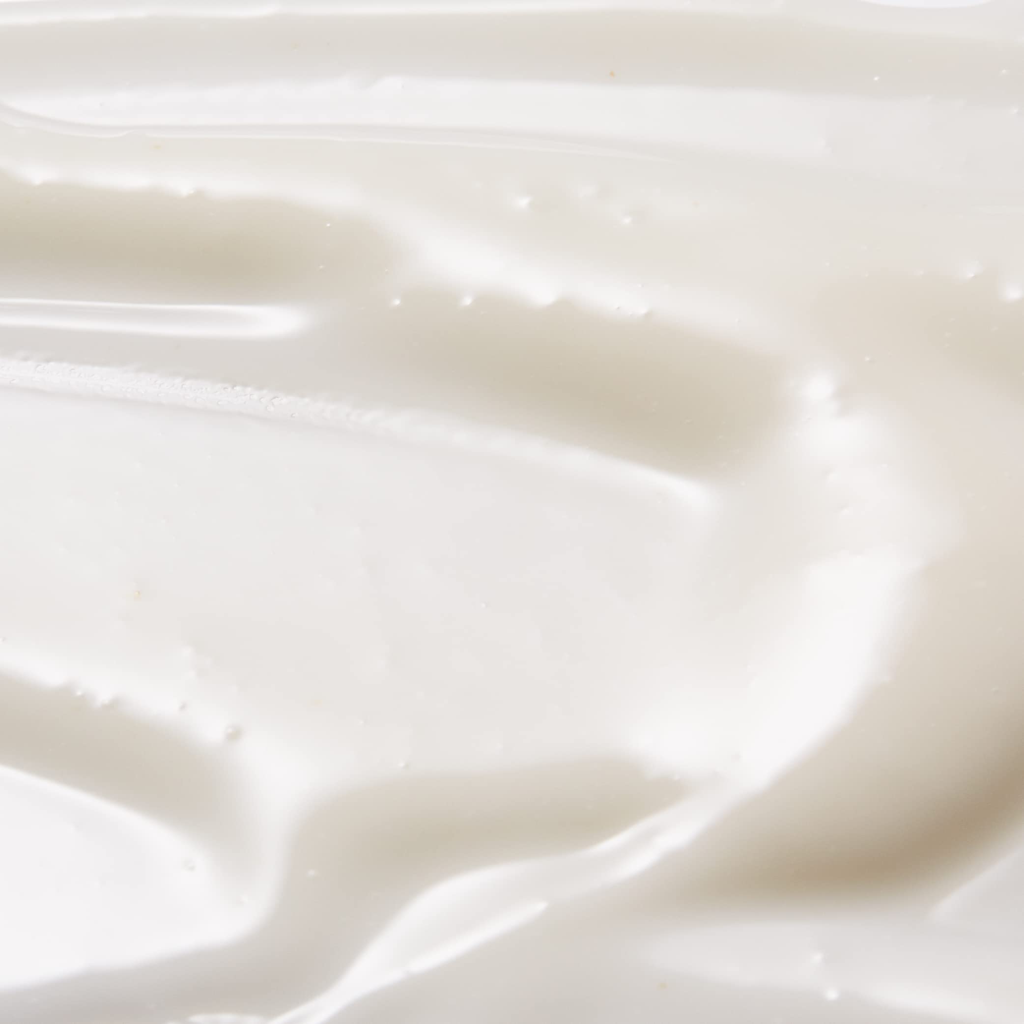 Tan-Luxe Gradual application being smoothed onto skin for hydration.
