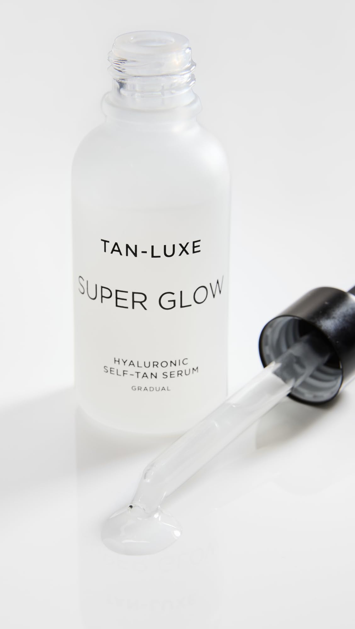 TAN-LUXE Super Glow on skin delivering subtle sun-kissed glow and renewed radiance.