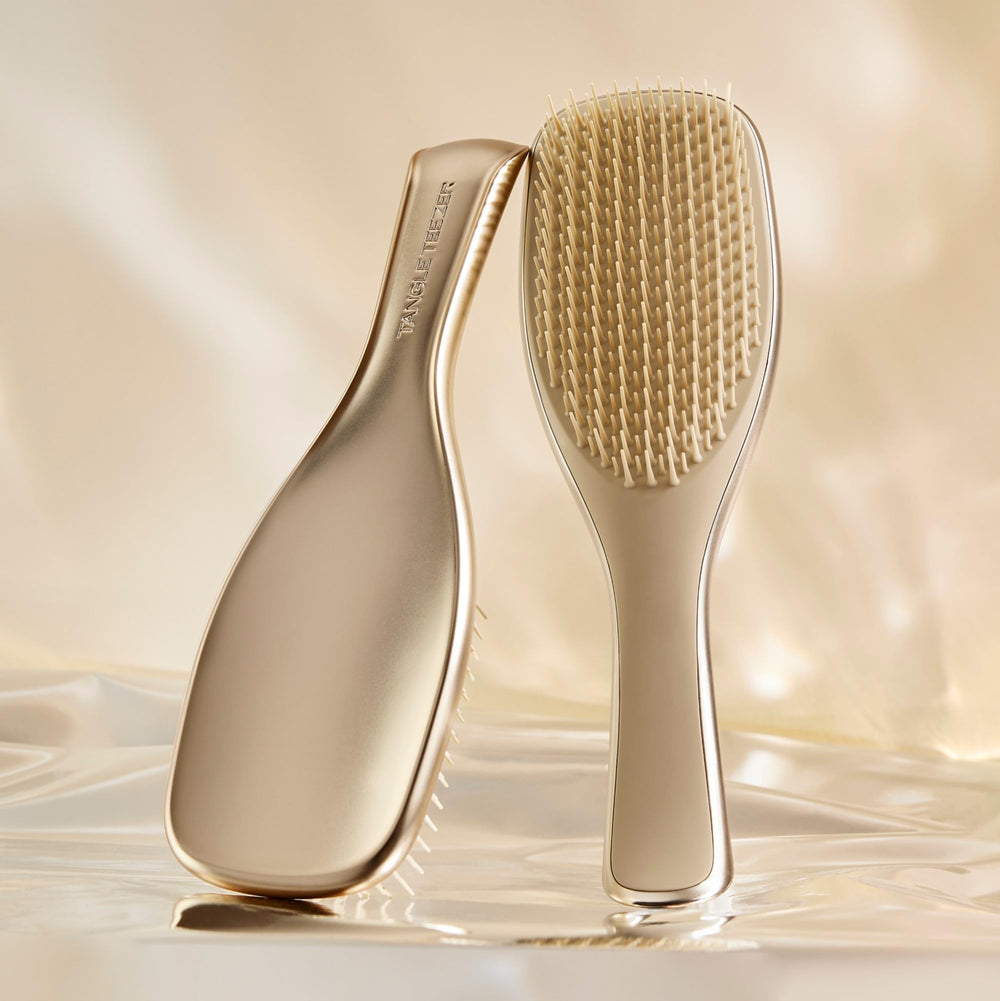 Tangle Teezer Chrome detangling teeth close-up showing two-tier design for knot removal and cuticle smoothing.