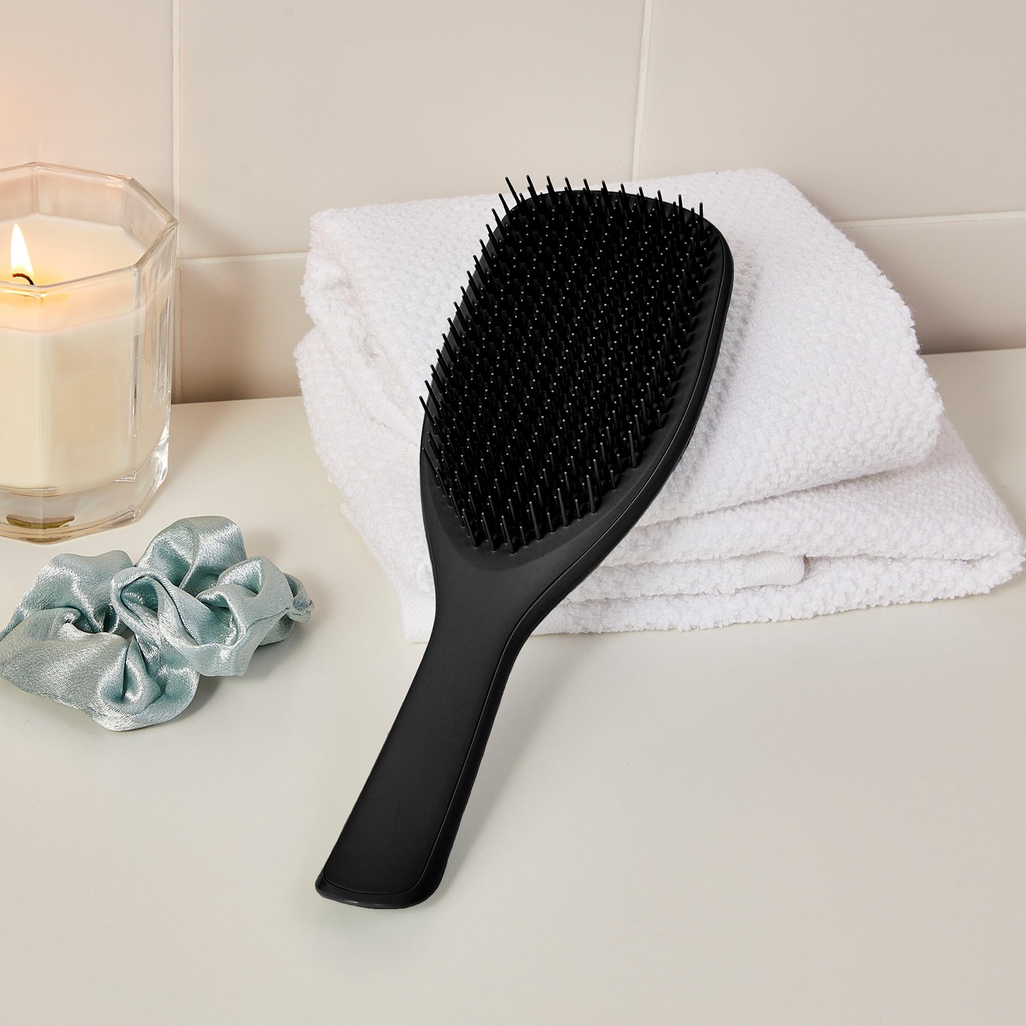 Tangle Teezer Large Ultimate Detangler aids even conditioner distribution through hair.