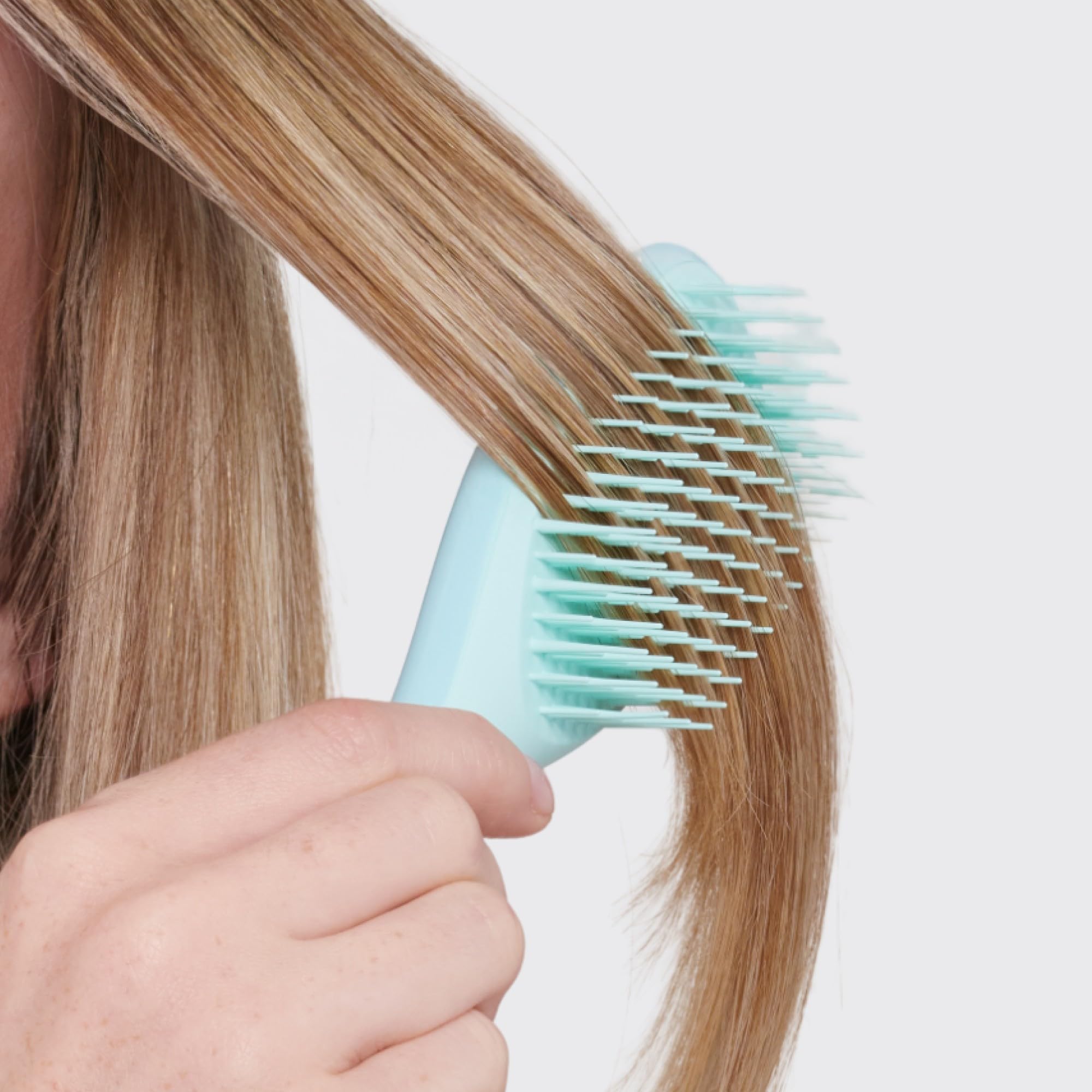 Tangle Teezer packaging mint box showcasing travel-friendly detangler.