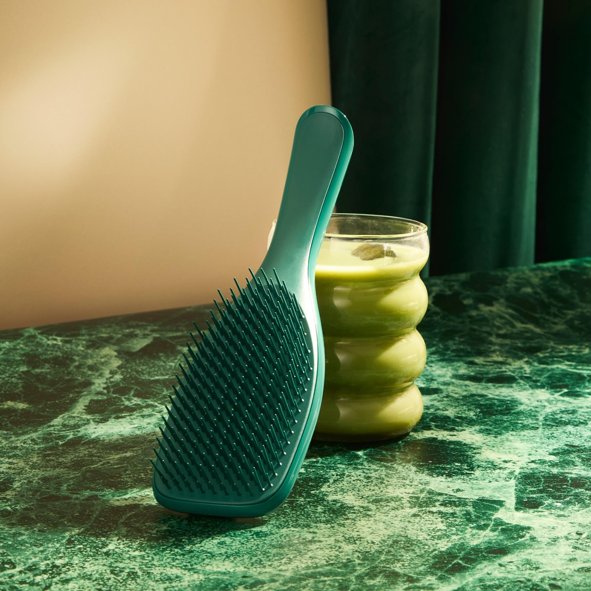 Tangle Teezer packaging in transition highlighting sustainability.