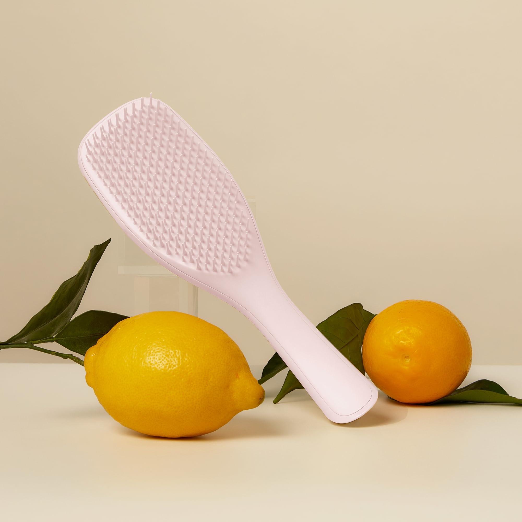 Tangle Teezer plant-based detangler brush product shot highlights sustainable design and performance.