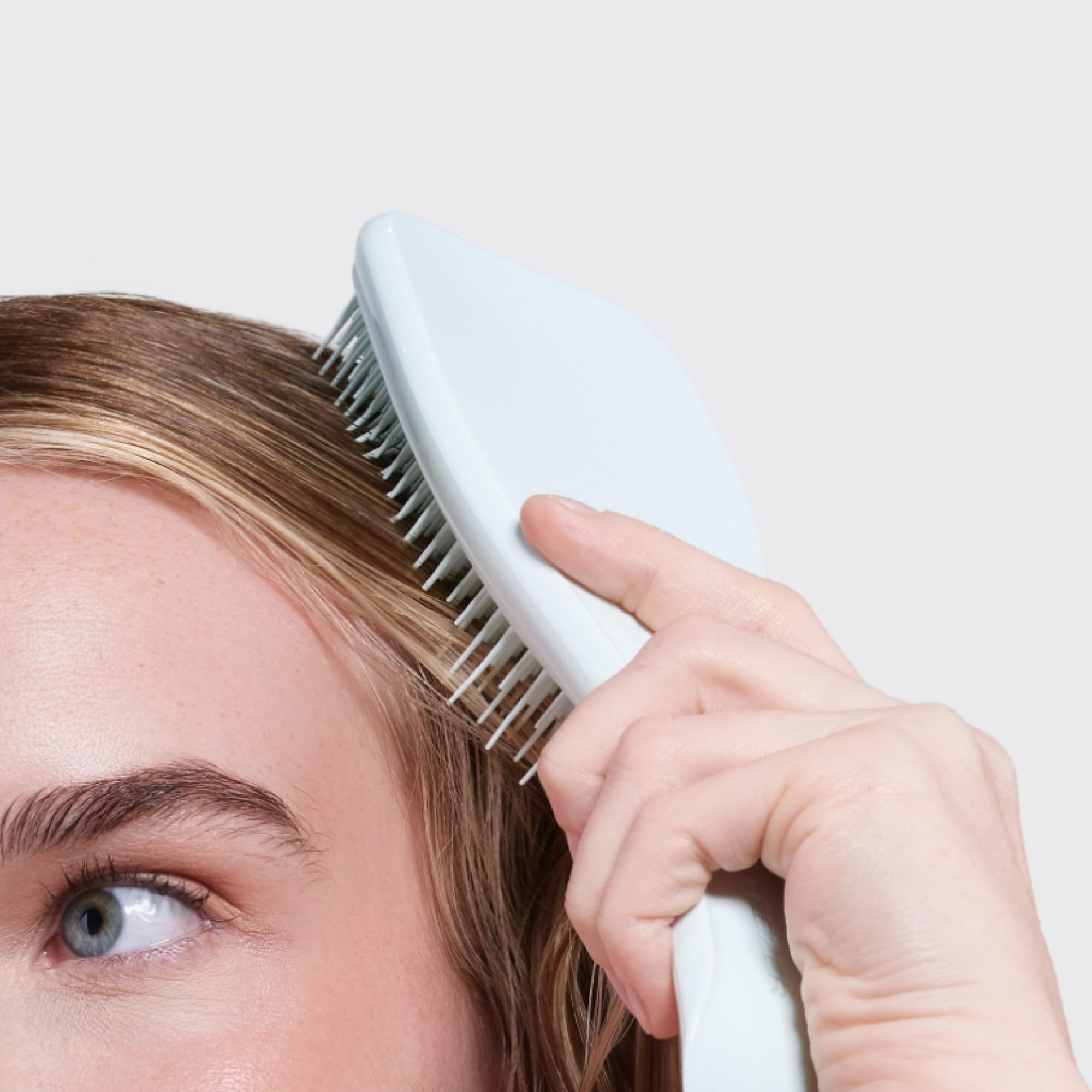 Tangle Teezer seafoam blue studio shot, ergonomic design