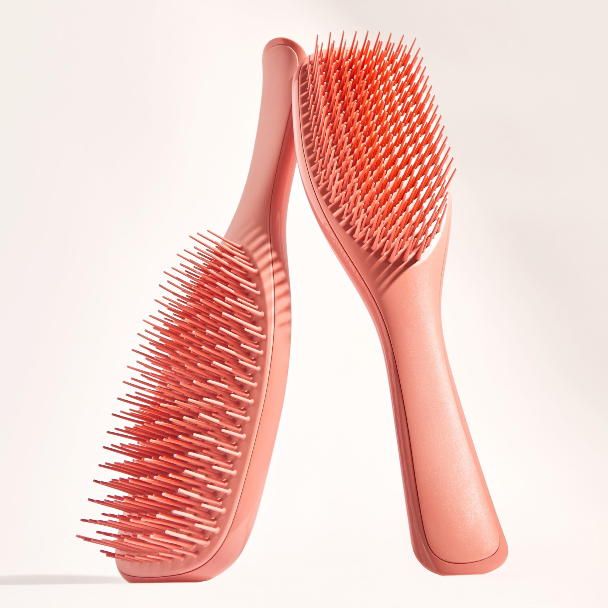 Tangle Teezer Sweet Cinnamon brush held in hand