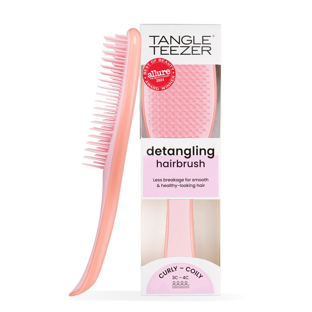 Tangle Teezer Ultimate Detangler brush in red smooths curls and detangles with ease.