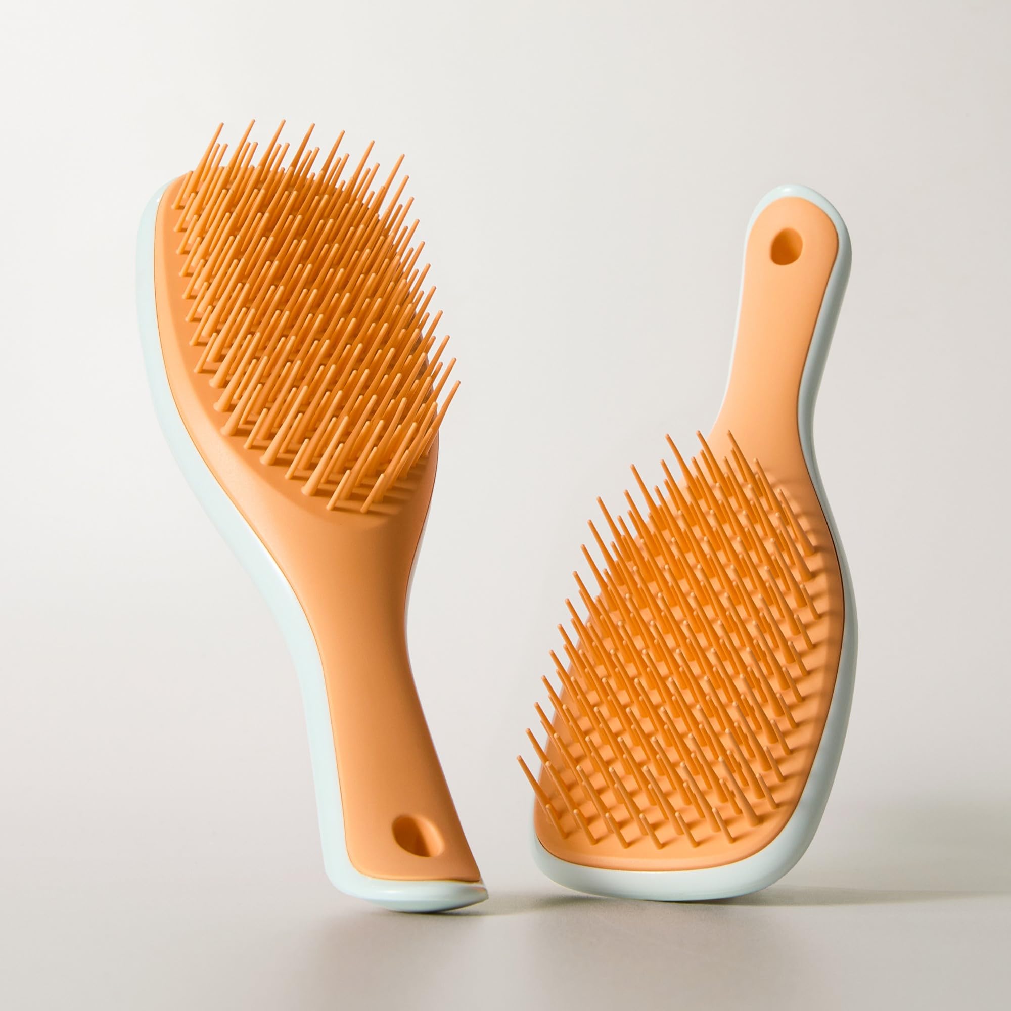 Tangle Teezer compact travel case shows portable detangler ready for packing.