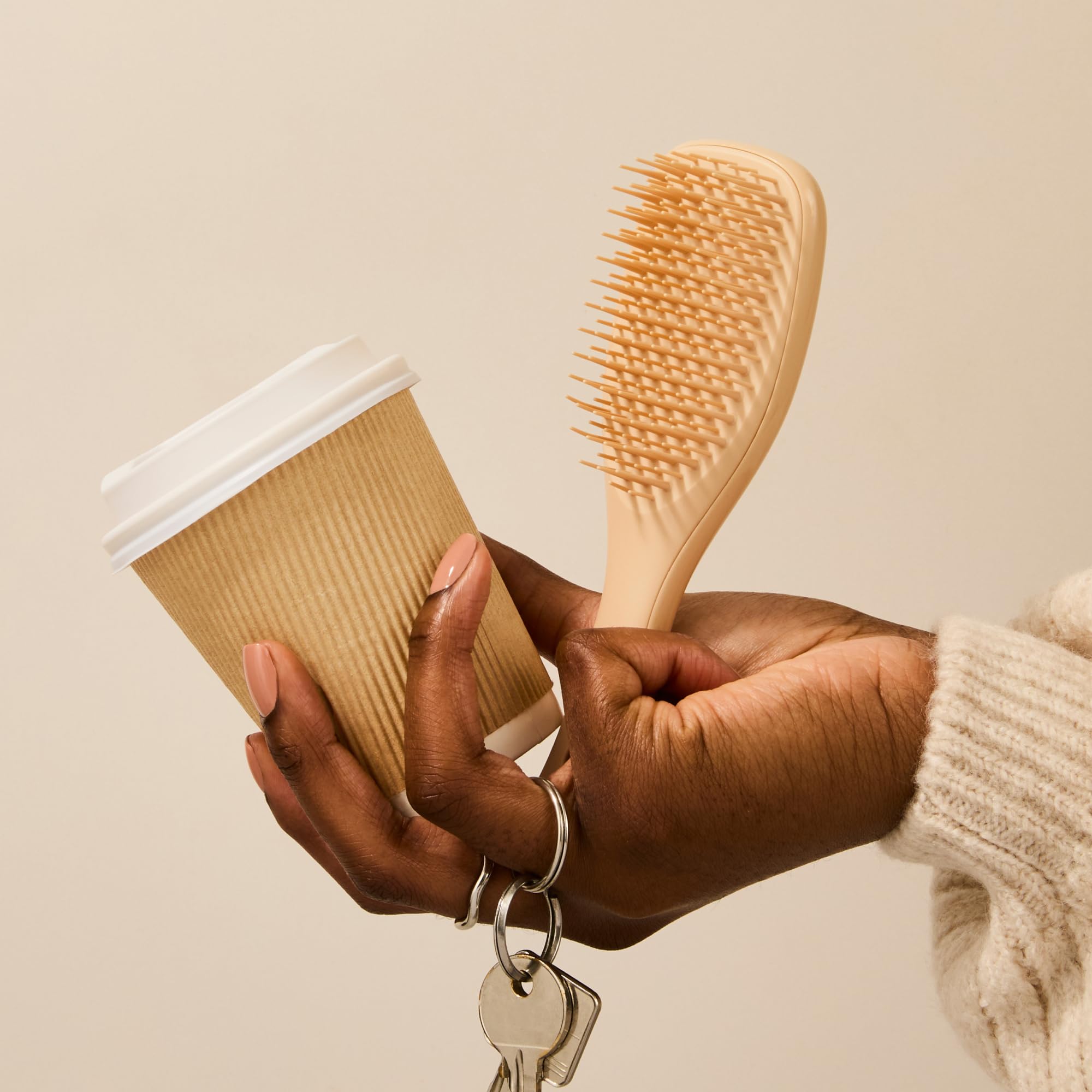 Tangle Teezer Ultimate Detangler Oat Cream color highlights a gentle travel-friendly design