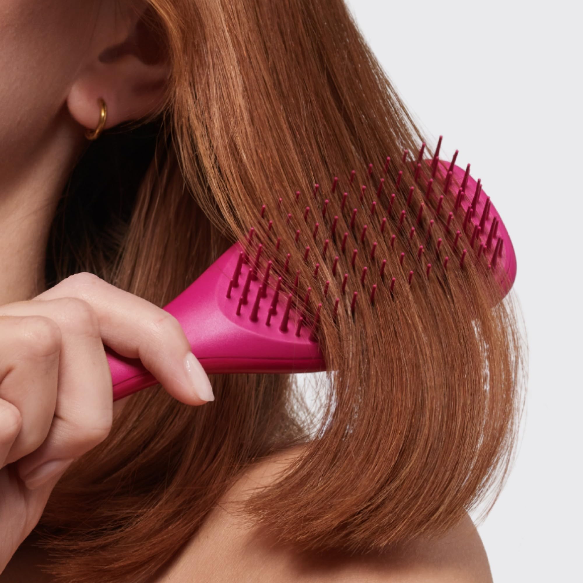 Tangle Teezer Ultimate Detangler close-up suggests reduced breakage with gentle detangling