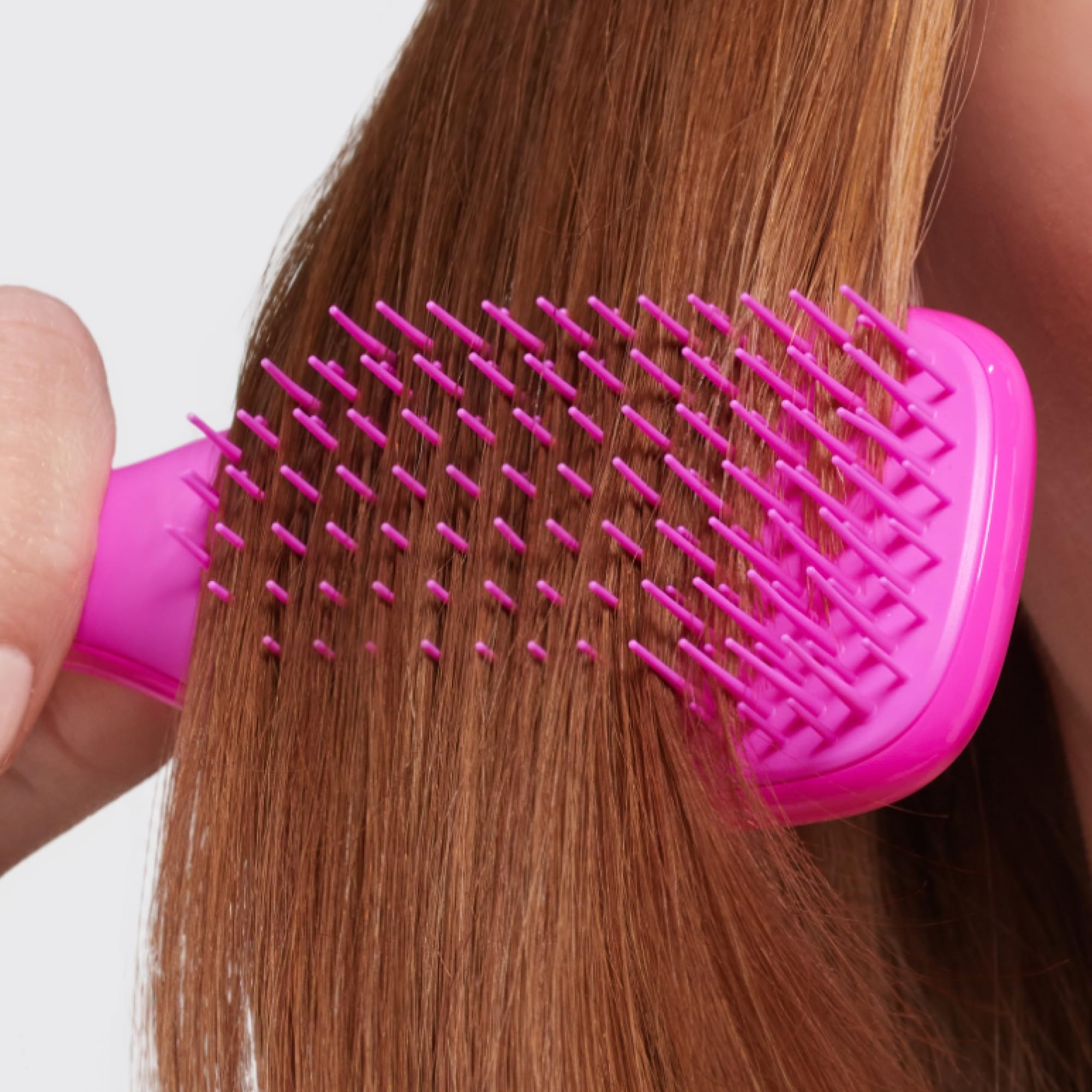 Tangle Teezer Runway Pink travel brush in purse-ready design.