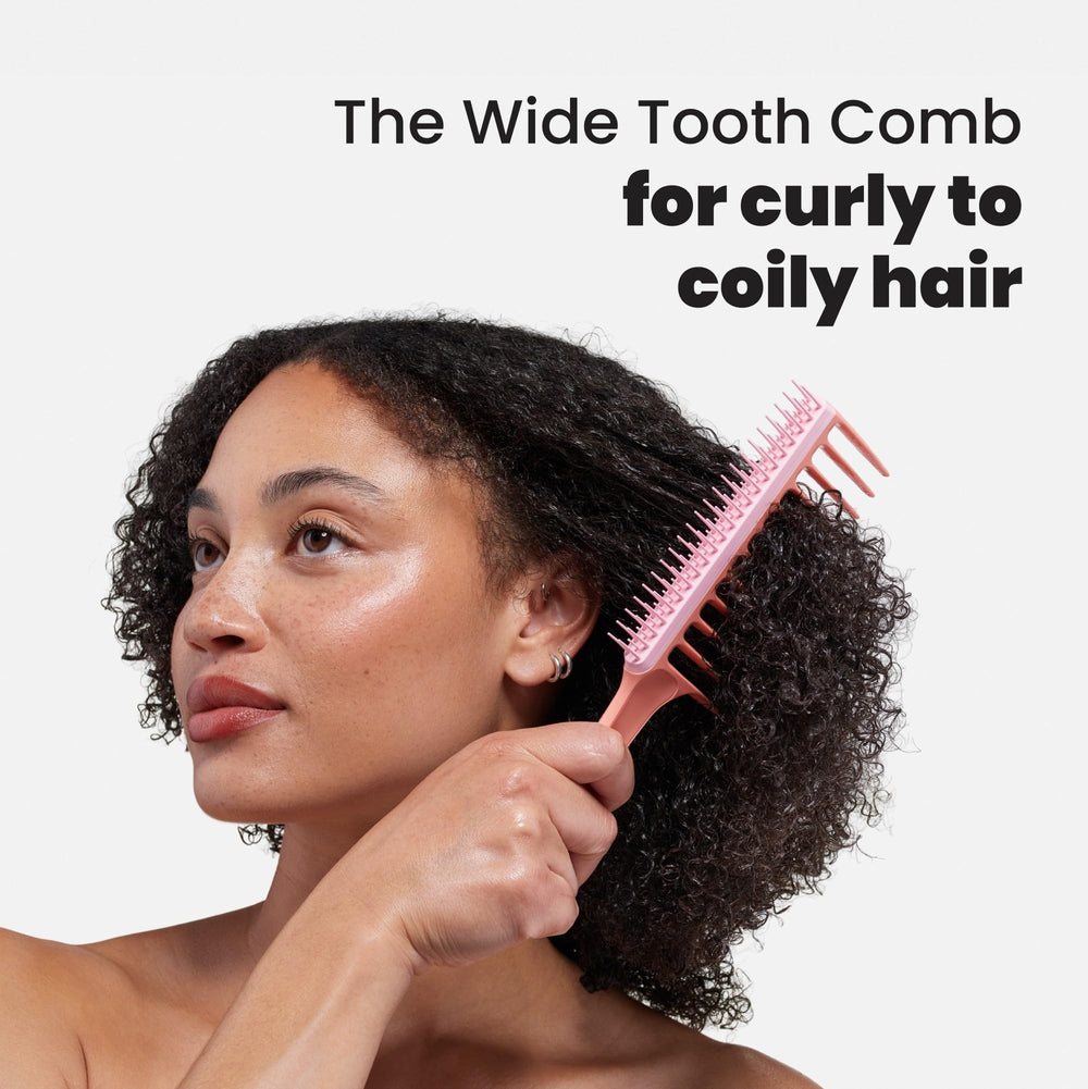 Tangle Teezer Wide Tooth Comb Peach long firm teeth glide through tangles with less tugging.