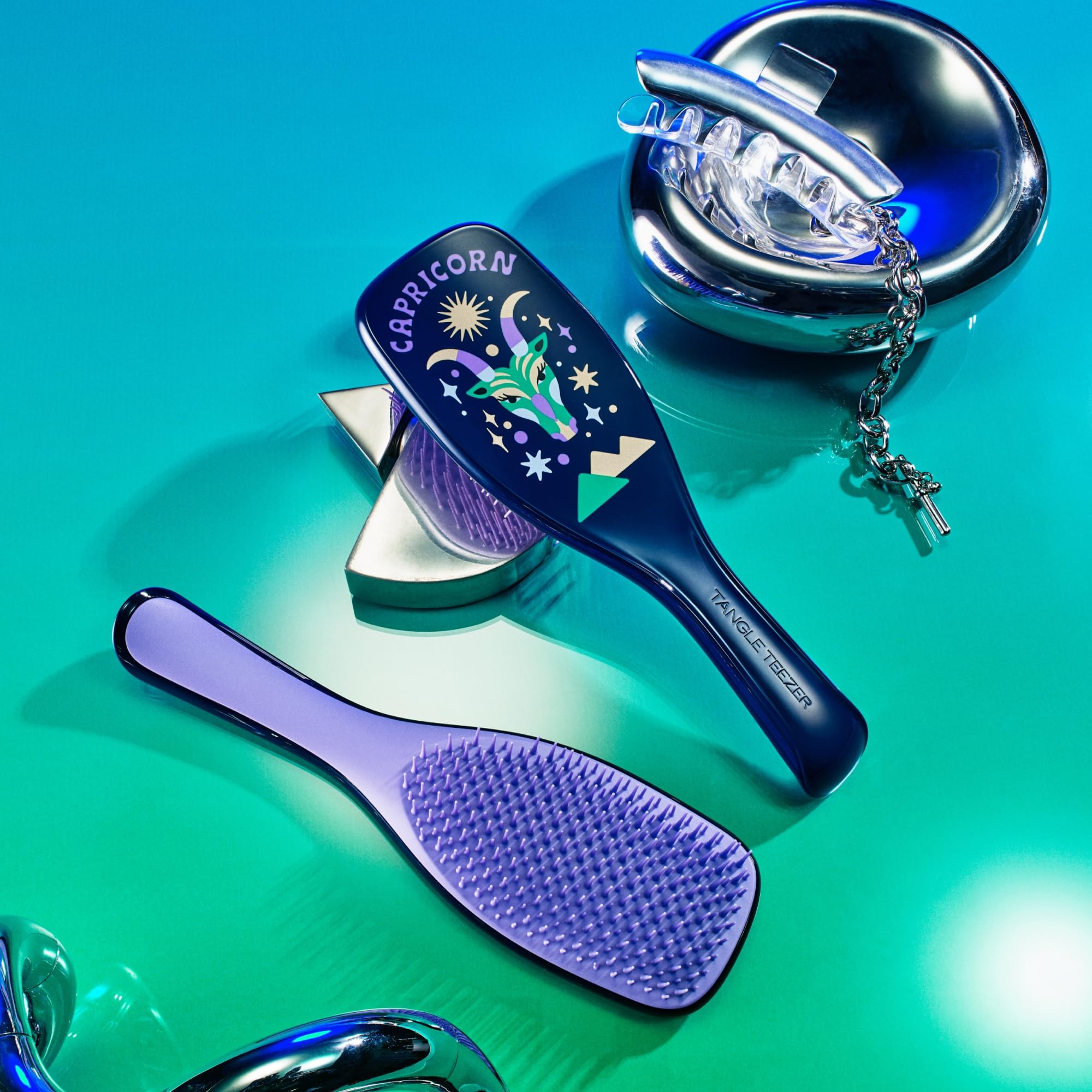 Tangle Teezer Zodiac Capricorn packaging angle presents gift-ready styling tool and zodiac art.