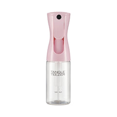 TANGLE TEEZER travel-size bottle in Millennial Pink for quick detangling between washes.