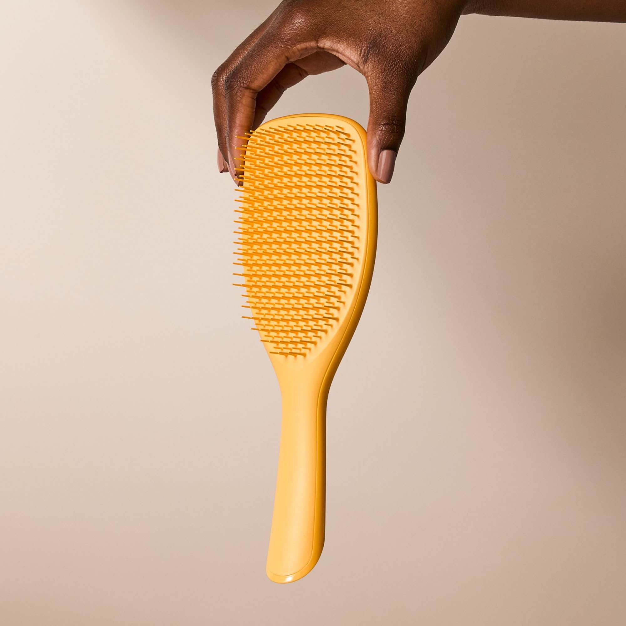 Tangle Teezer Ultimate Detangler shown in shower for smoother, silky results