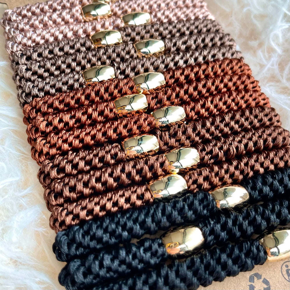 Tanha hair ties with gold-plated beads add stylish accent while keeping hair secure.