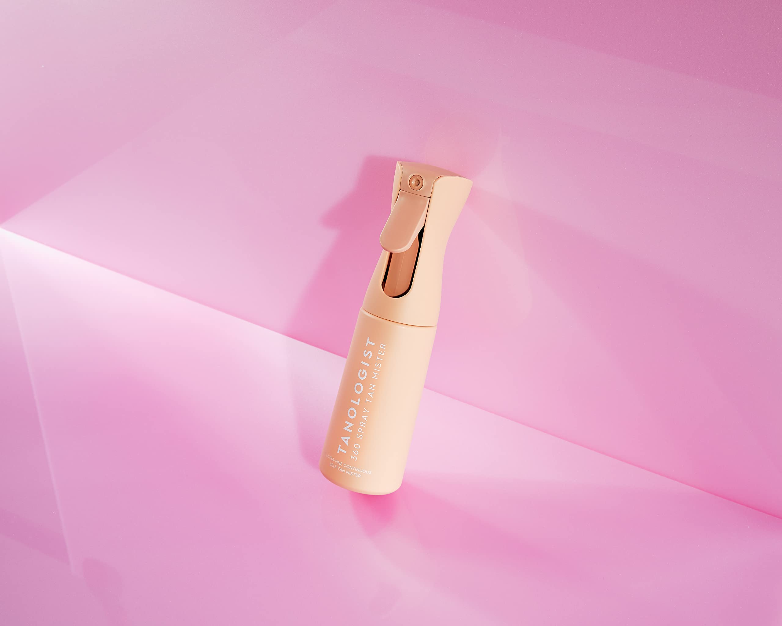 Tanologist 360 Spray Tan Mister in-use demonstrates continuous spray for efficient application