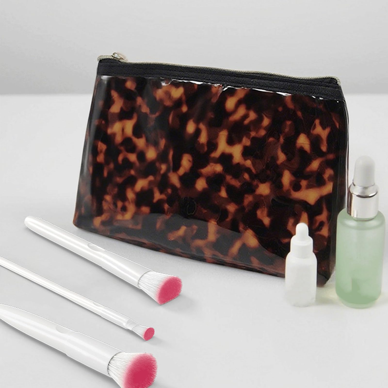 Tarvione tortoise purse makeup essentials neatly organized for everyday use.