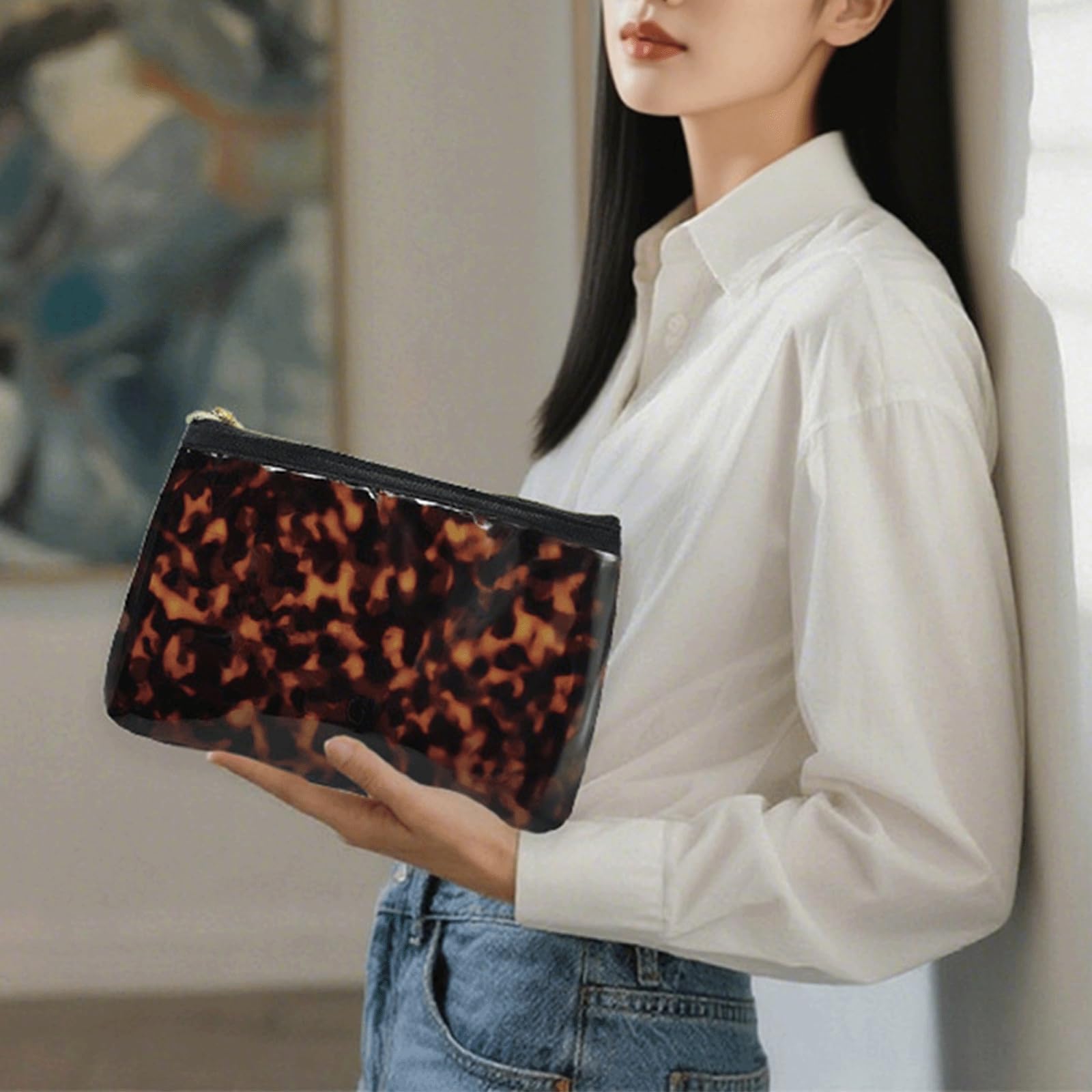 Tarvione tortoise purse side view shows slim profile for easy purse fit.