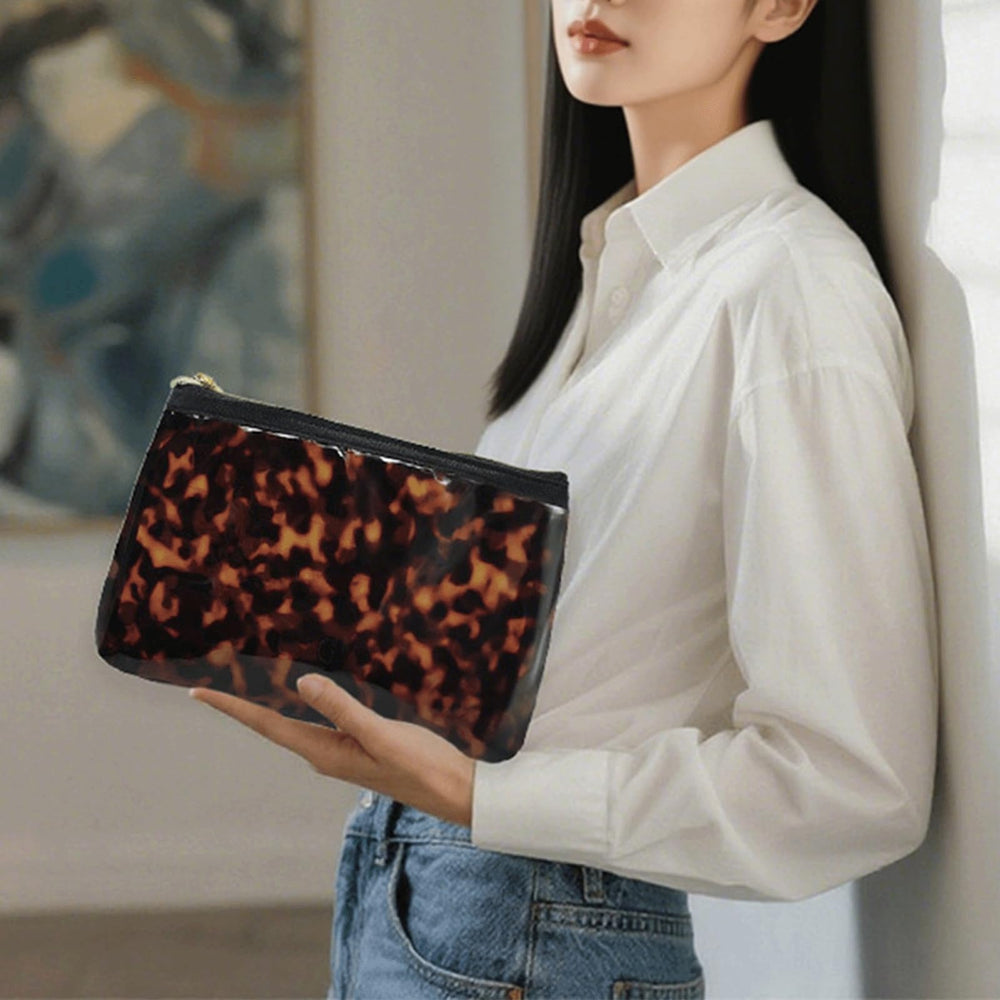 Tarvione tortoise purse side view shows slim profile for easy purse fit.
