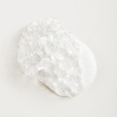 Tata Harper Superkind Softening Cleanser foam closeup highlights creamy texture that hydrates while cleansing.