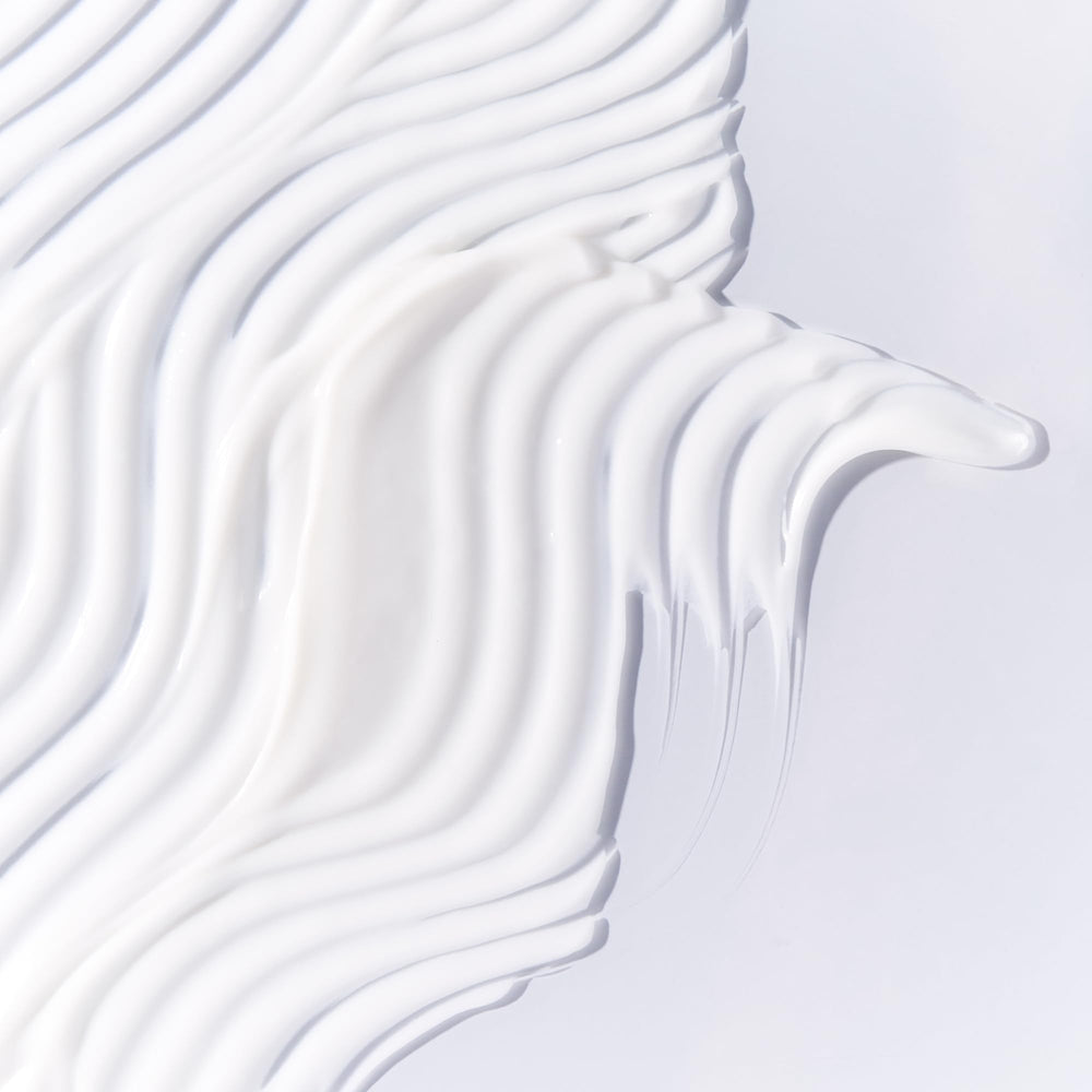 Tata Harper Water-Lock Moisturizer gel-cream texture swirl indicating lightweight hydration and quick absorption.