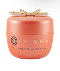 TATCHA Brightening Eye Cream tube close-up shows creamy texture for brightening under eyes.