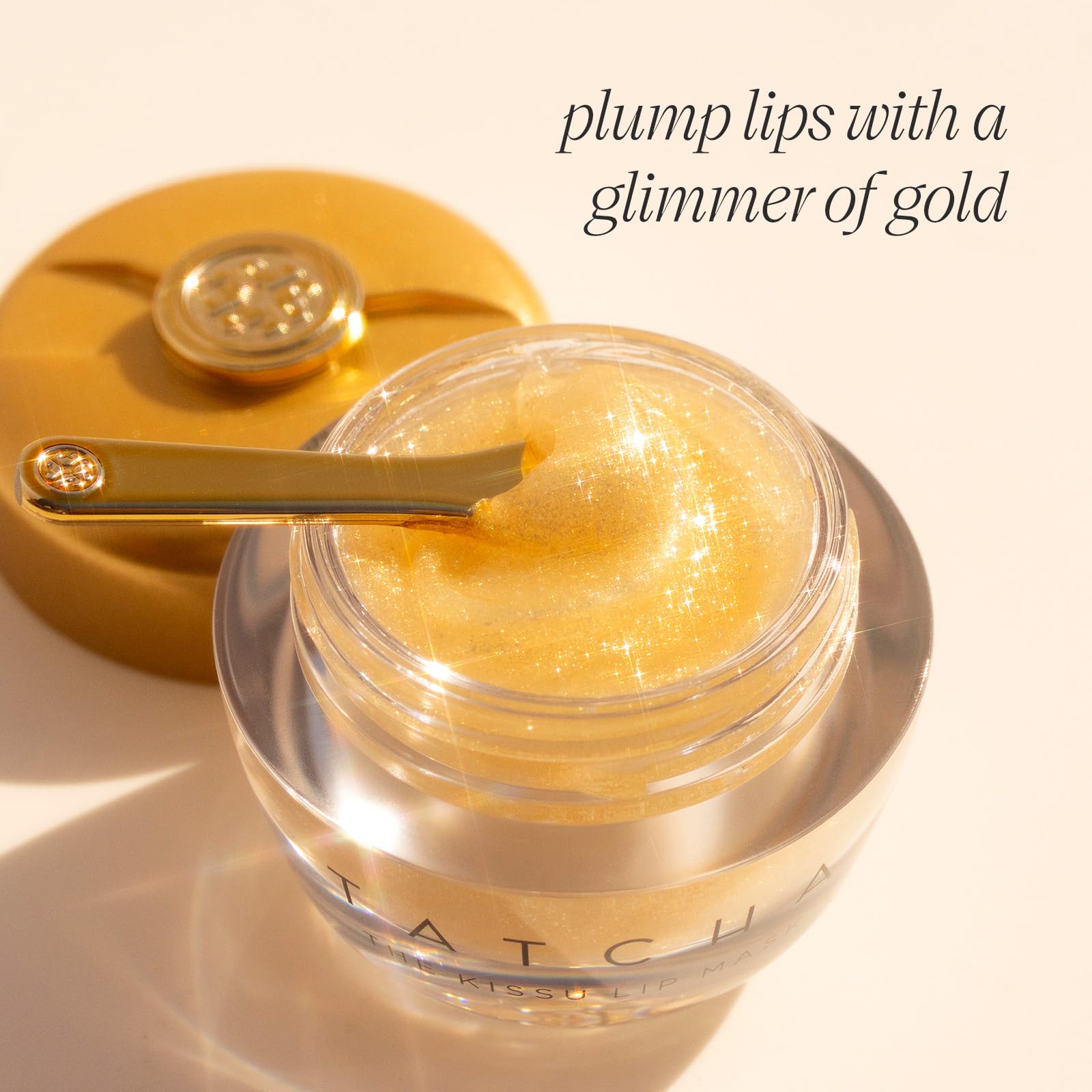 TATCHA Kissu Gold Leaf Lip Mask being applied offers a non-sticky, moisturized feel.