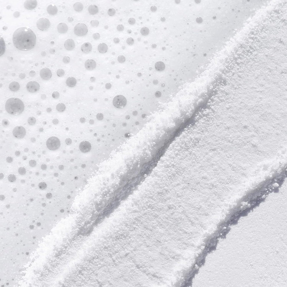 TATCHA Rice Polish Classic damp-face application shows non-abrasive daily ritual.