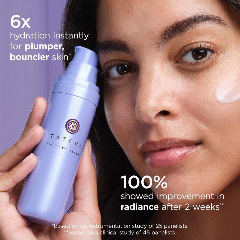 TATCHA Rice Wash texture close-up, creamy foam forming on fingertips.