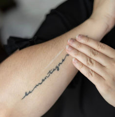 Tattoo Goo balm application on skin demonstrates soothing aftercare for fresh tattoos