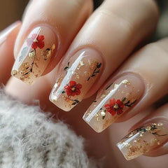 TBRZTR flower press-on nails in medium ballet shape with gold glitter for a glossy spring look.