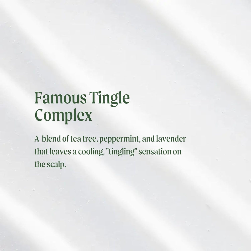 Tea Tree Special Conditioner being applied to damp hair for smoothing and softness