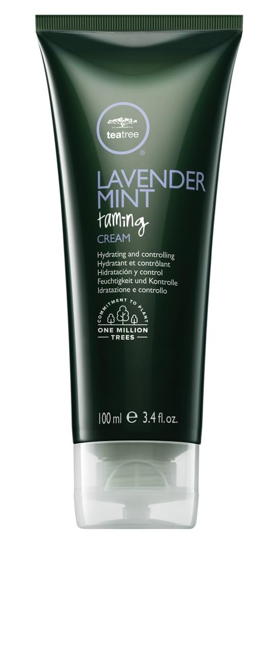 Tea Tree Lavender Mint Taming Cream bottle on desk boosts frizz control and hydration