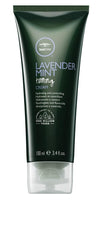 Tea Tree Lavender Mint Taming Cream bottle on desk boosts frizz control and hydration