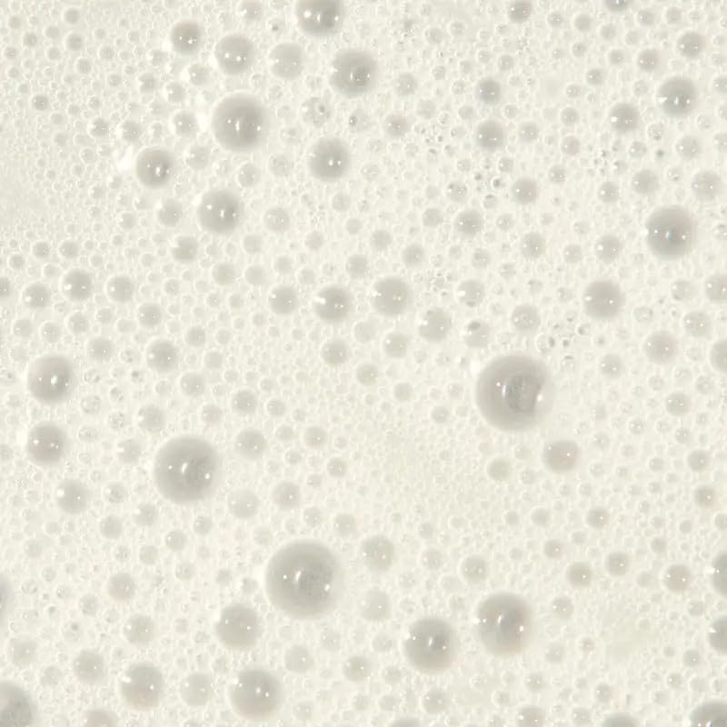 Fragrance swirl on Tea Tree Regeniplex bottle communicates refreshing lemon-basil-fir scent.