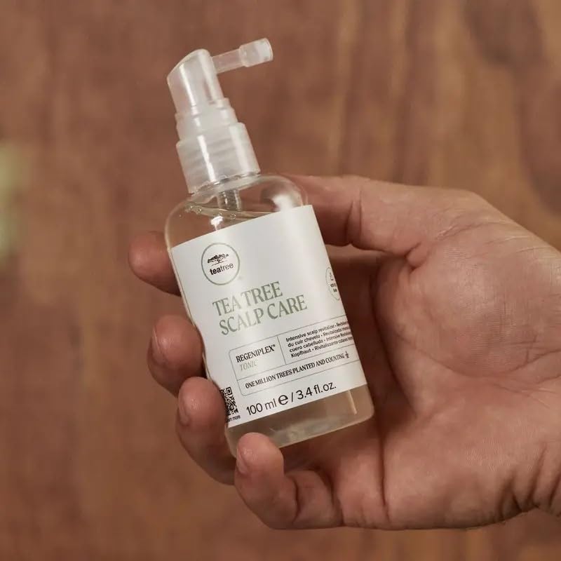 Tea Tree Regeniplex tonic spray application enables even scalp coverage.
