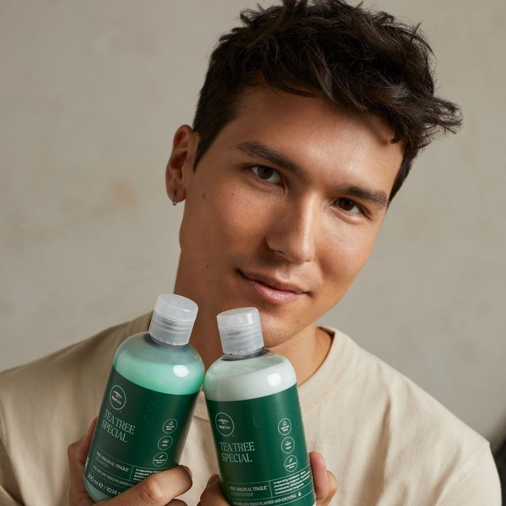  Tea Tree Special Conditioner applying through hair to smooth tangles