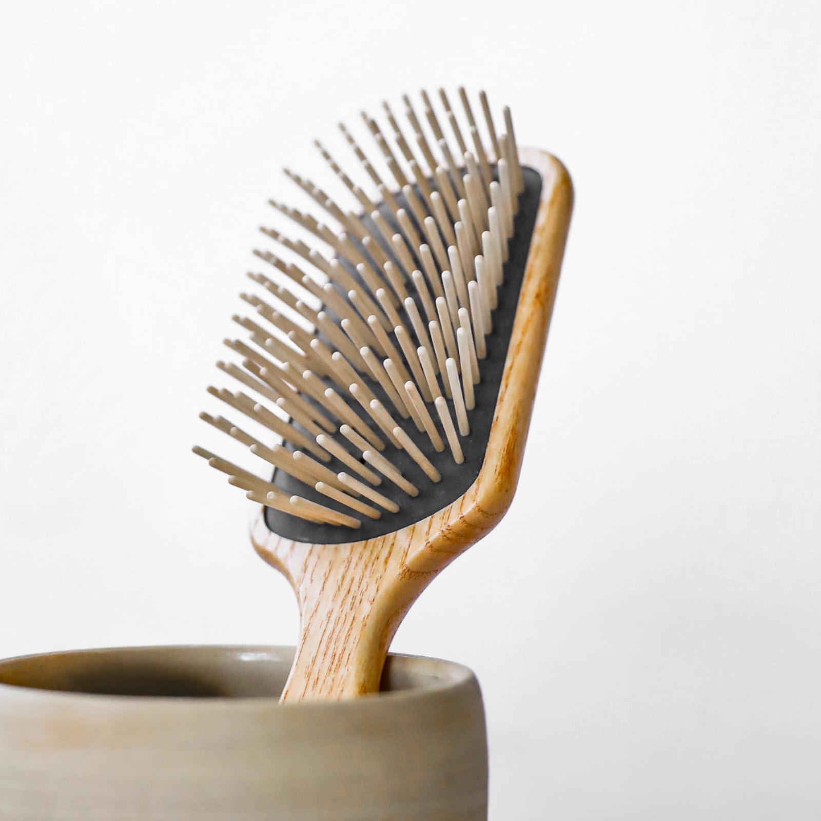 TEK long-pin hornbeam detangler demonstrates smooth glide through hair