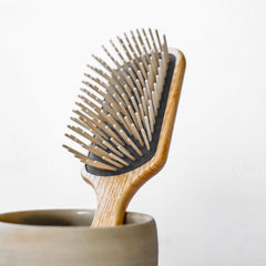 TEK long-pin hornbeam detangler demonstrates smooth glide through hair