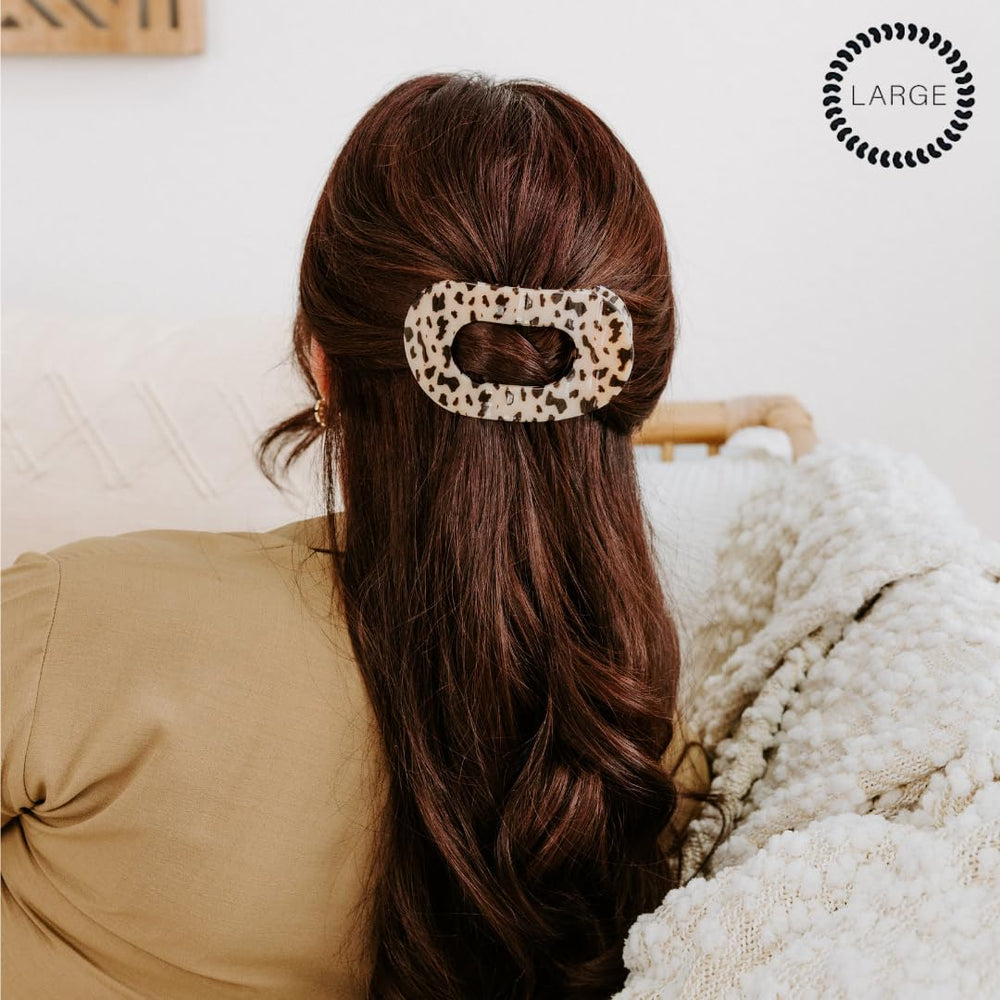 Teleties large flat round clip highlights bendable teeth for durable, reusable styling.